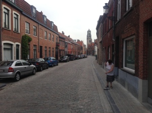 This seemed quintessential Dutch/European to me - woman sweeps a perfectly clean street/sidewalk early in the morning.